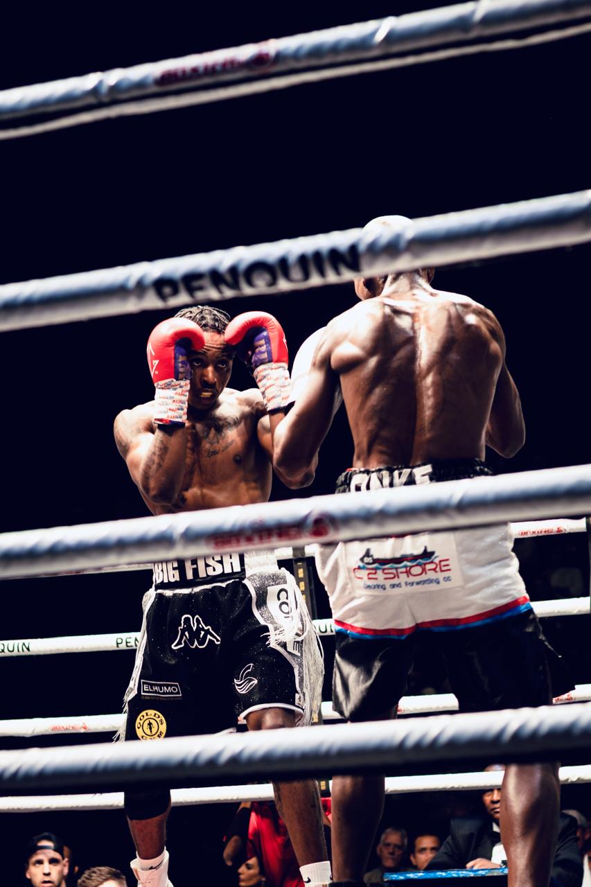 Creed Moyo hand raised in victory
